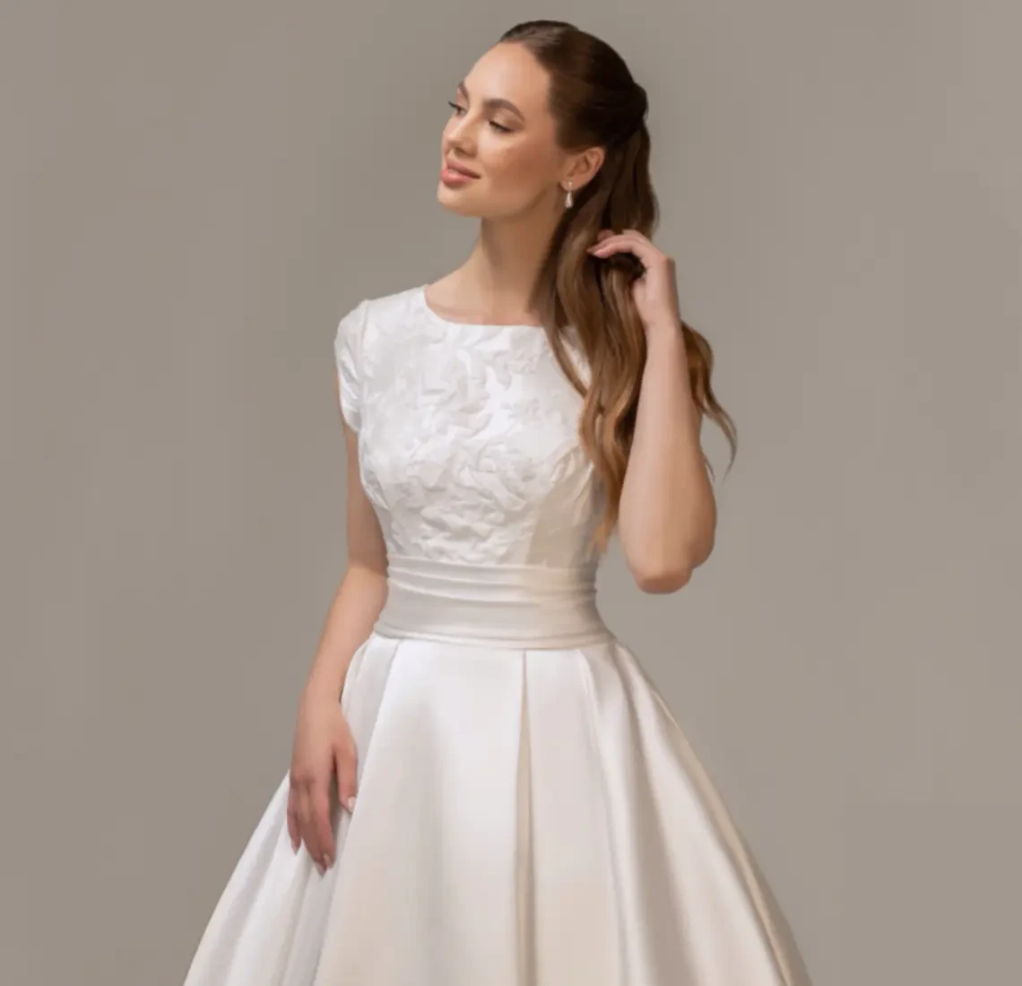 Model wearing an Modest Dresses $1500 - $1999 gown