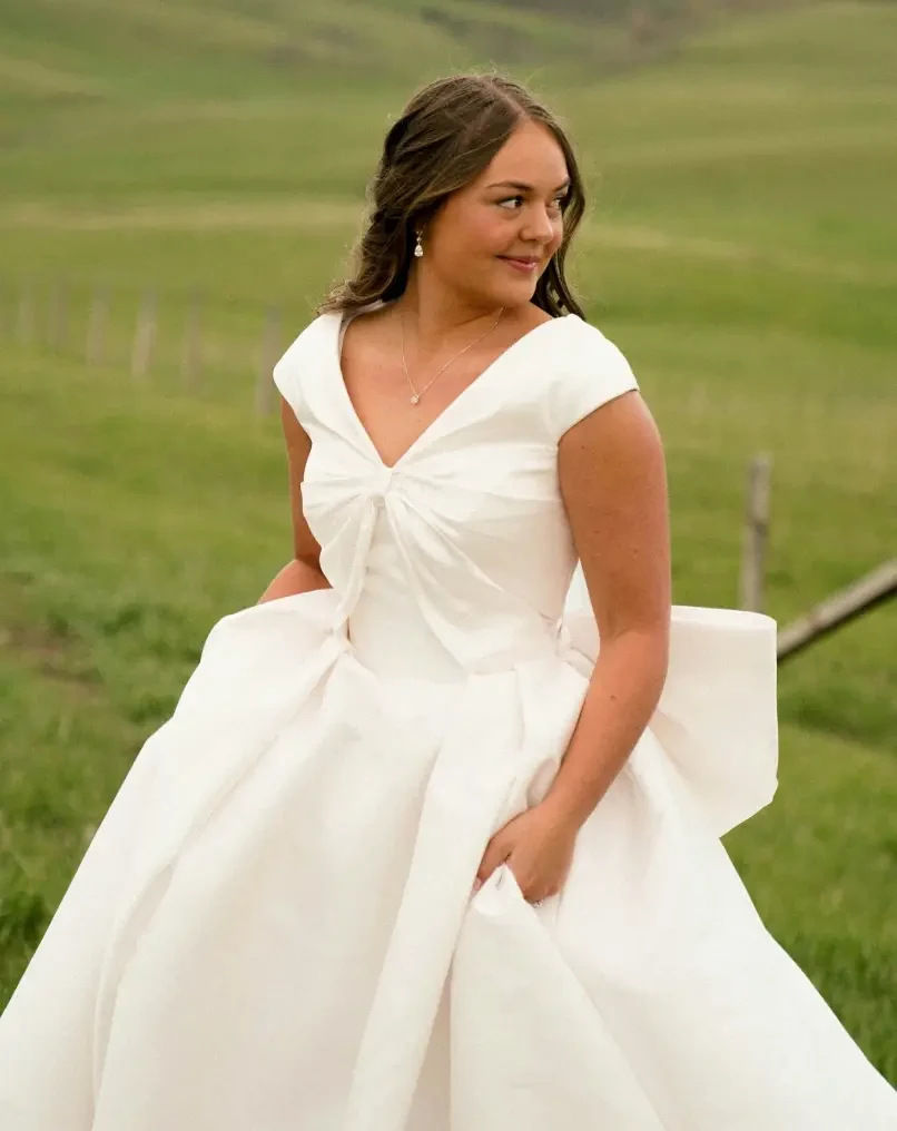 Photo of the model wearing a white gown